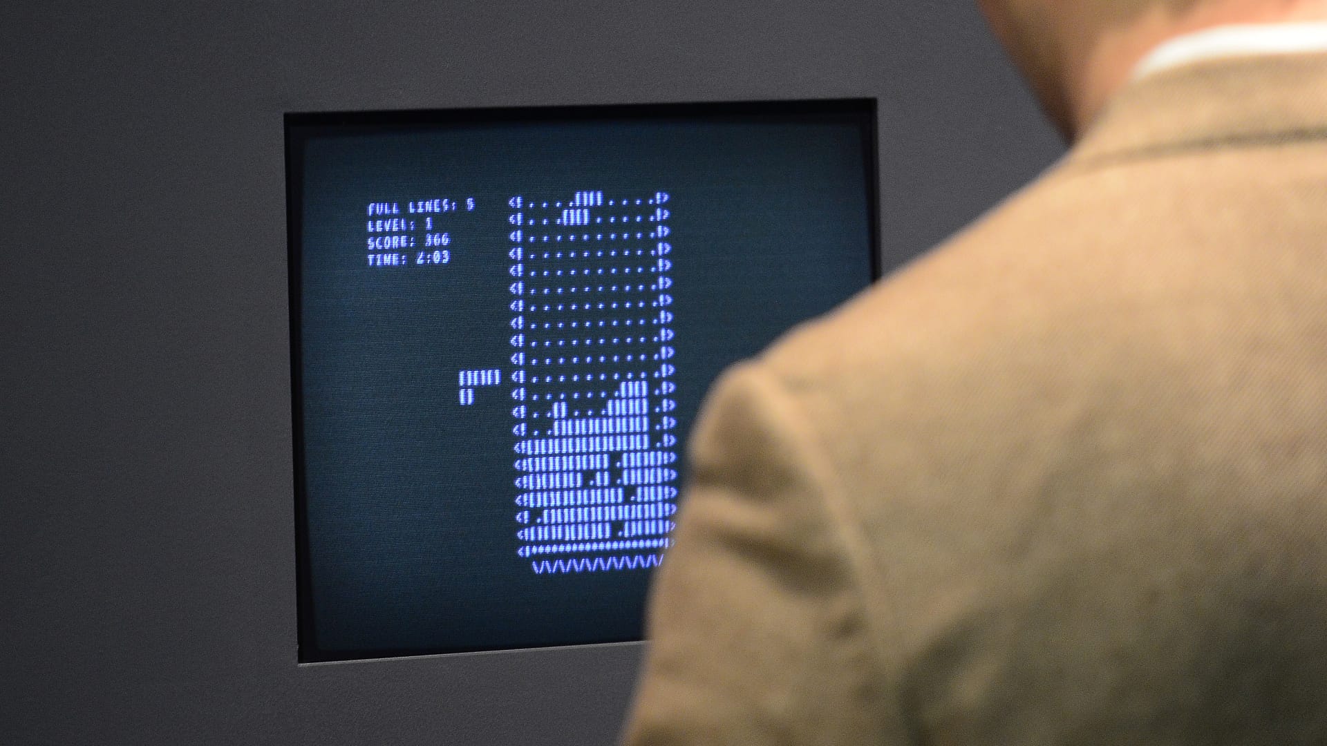 A visitor plays the video game Tetris (1984) during an exhibition preview featuring 14 video games acquired by The Museum of Modern Art (MoMA) in New York, March 1, 2013.