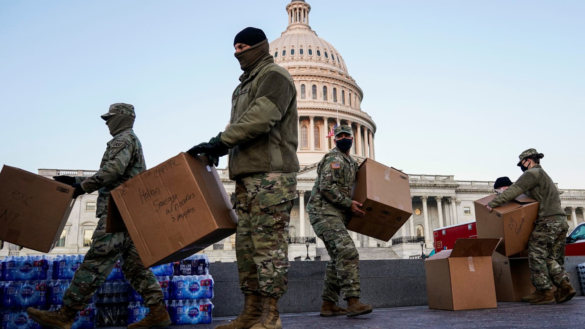 Members of the National Guard move boxes of food at the U.S. Capitol as Democratic members of the House prepare an article of impeachment against U.S. President Donald Trump in Washington, U.S., January 12, 2021.