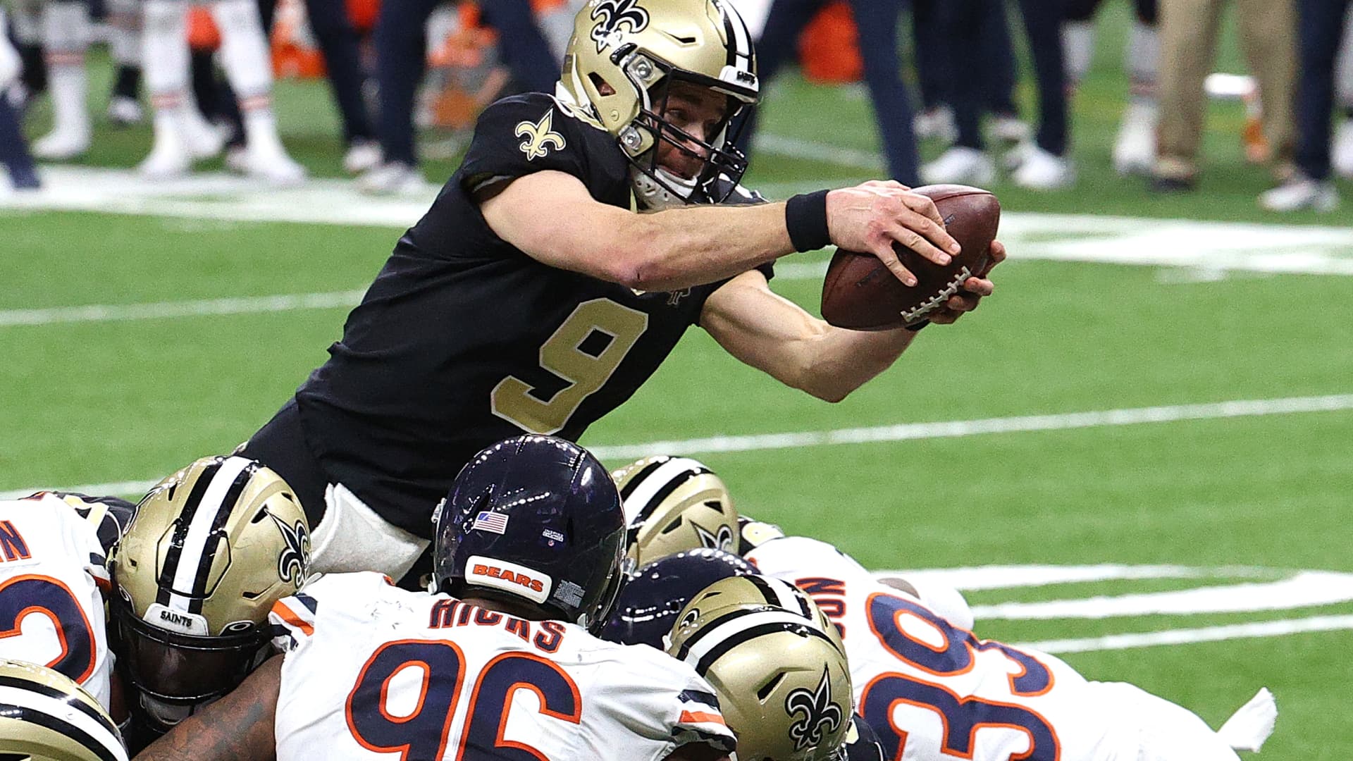 Drew Brees #9 of the New Orleans Saints dives in the end zone to score a one yard touchdown against the Chicago Bears during the fourth quarter in the NFC Wild Card Playoff game at Mercedes Benz Superdome on January 10, 2021 in New Orleans, Louisiana.