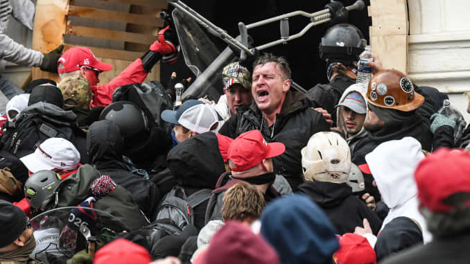 Supporters of U.S. President Donald Trump battle with police at the west entrance of the Capitol during a Stop the Steal protest outside of the Capitol building in Washington D.C. January 6, 2021.