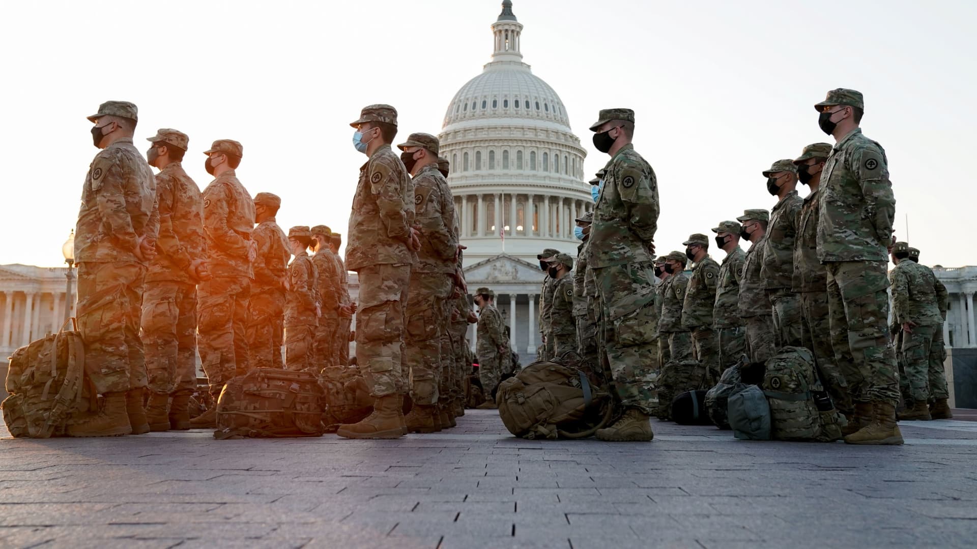 Members of the National Guard gather at the U.S. Capitol as the House of Representatives prepares to begin the voting process on a resolution demanding U.S. Vice President Pence and the cabinet remove President Trump from office, in Washington, January 12, 2021.