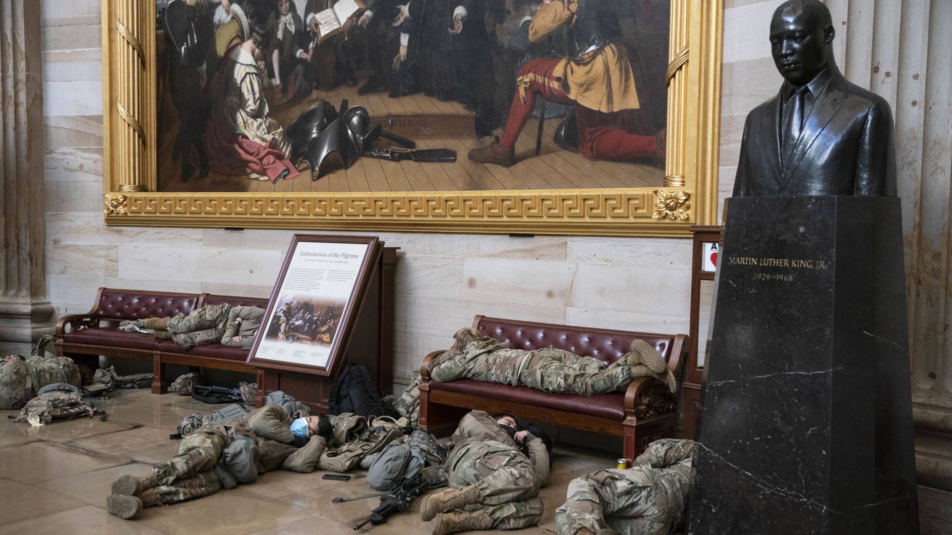 Members of the National Guard rest in the Rotunda of the U.S. Capitol building in Washington, D.C., U.S., on Wednesday, Jan. 13, 2021.
