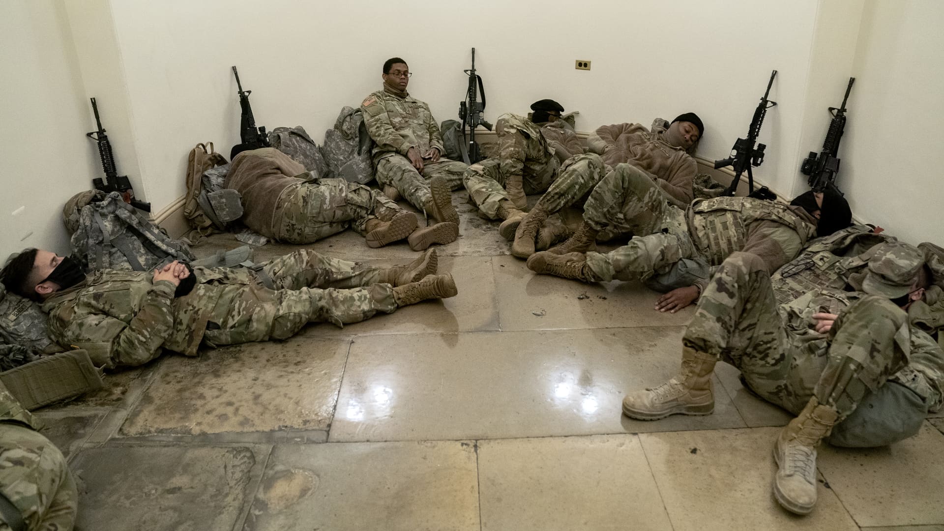 Members of the National Guard rest in the U.S. Capitol on January 13, 2021 in Washington, DC.