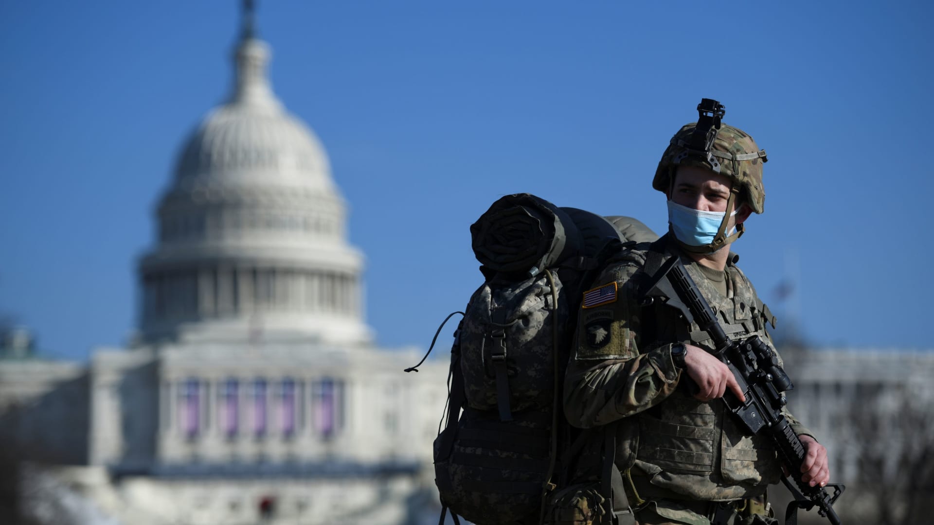 A member of the National Guard mounts guard near the U.S. Capitol building, as the House of Representatives debates impeaching U.S. President Donald Trump a week after his supporters stormed the Capitol building in Washington, U.S., January 13, 2021.