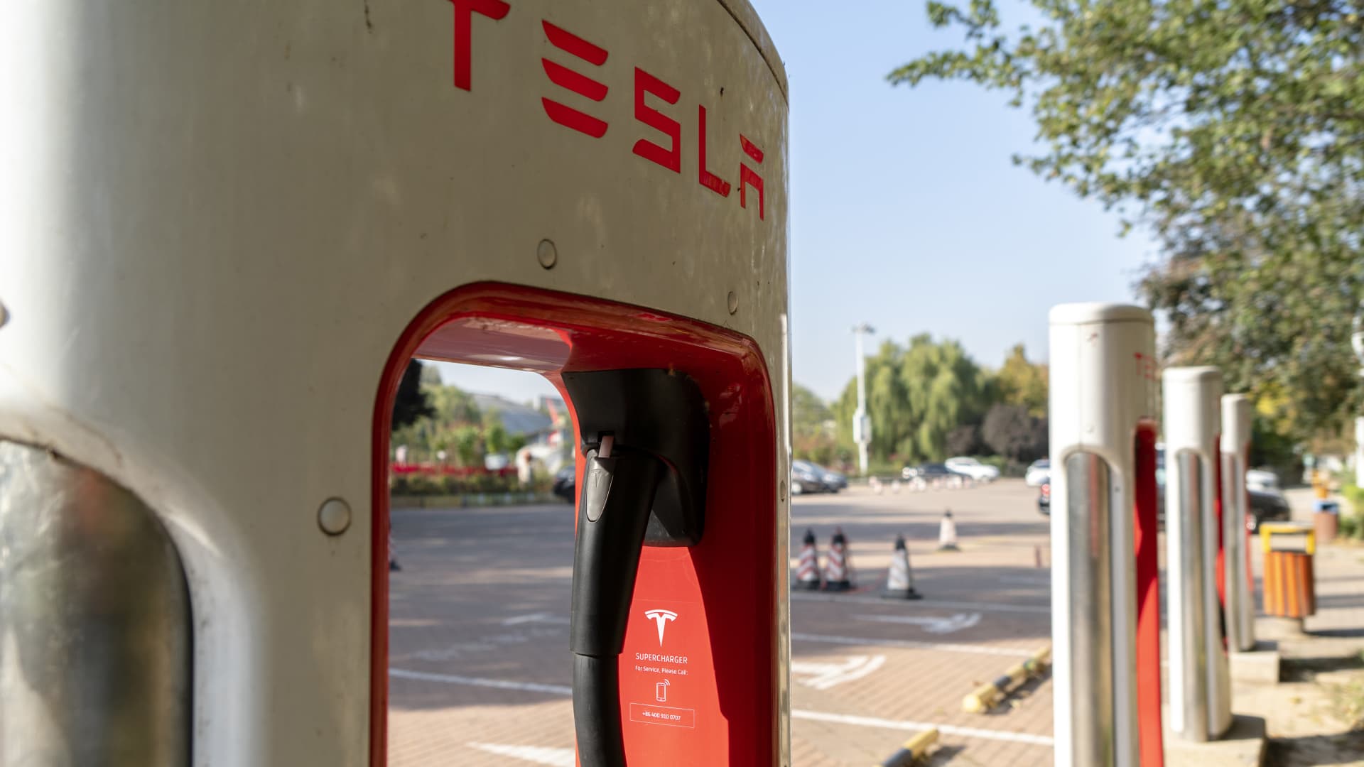A Tesla charging station in a hotel parking lot.