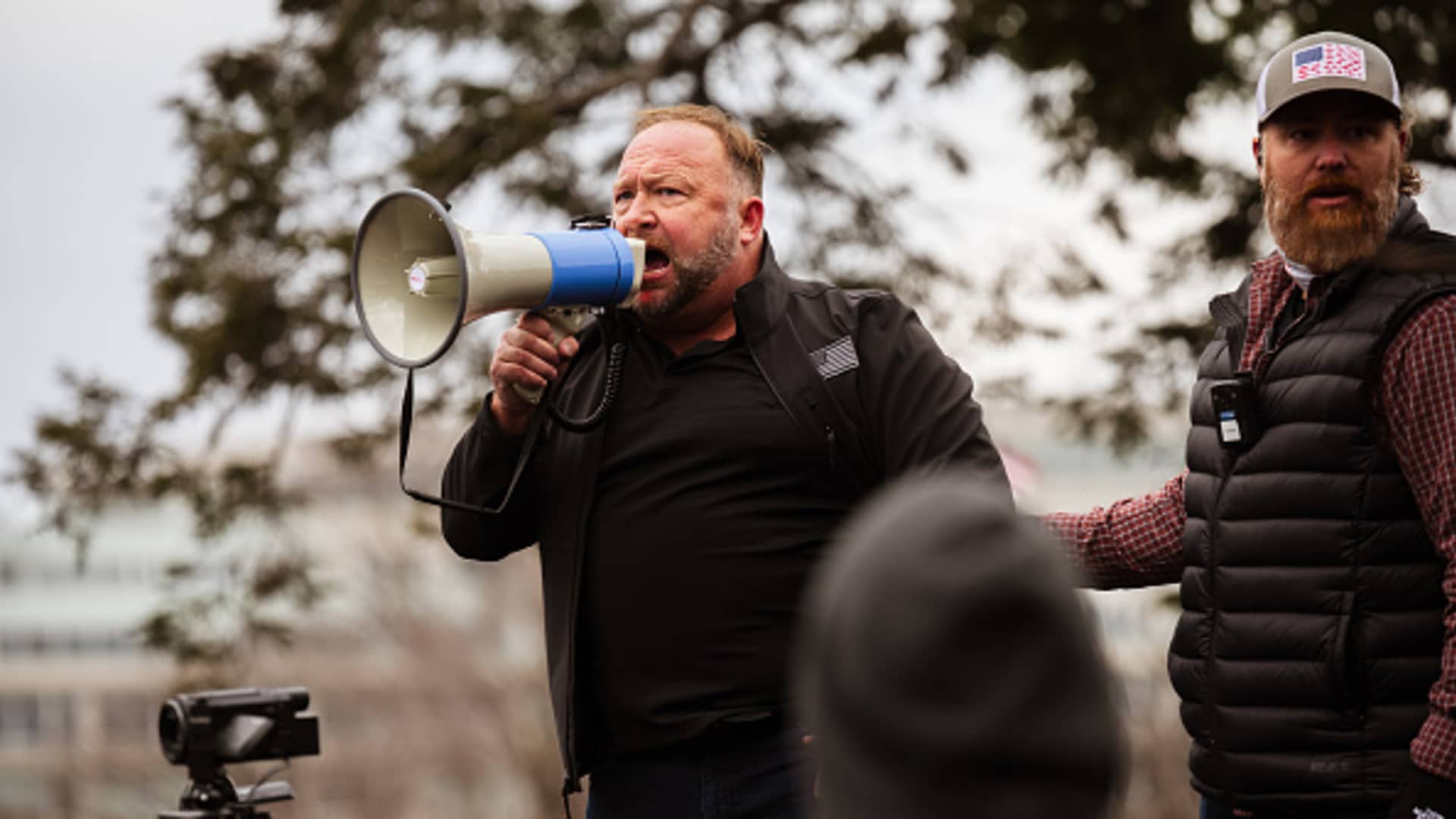 Alex Jones, the founder of right-wing media group Infowars, addresses a crowd of pro-Trump protesters after they storm the grounds of the Capitol Building on January 6, 2021 in Washington, DC.