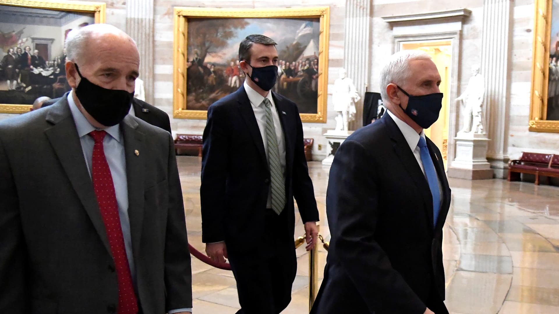 Vice President Mike Pence (R) is escorted by Sgt. at Arms Michael Stenger (L), from the House of Representatives to the Senate at the U.S. Capitol after a challenge was raised during the joint session to certify President-elect Joe Biden, in Washington, U.S., January 6, 2021.