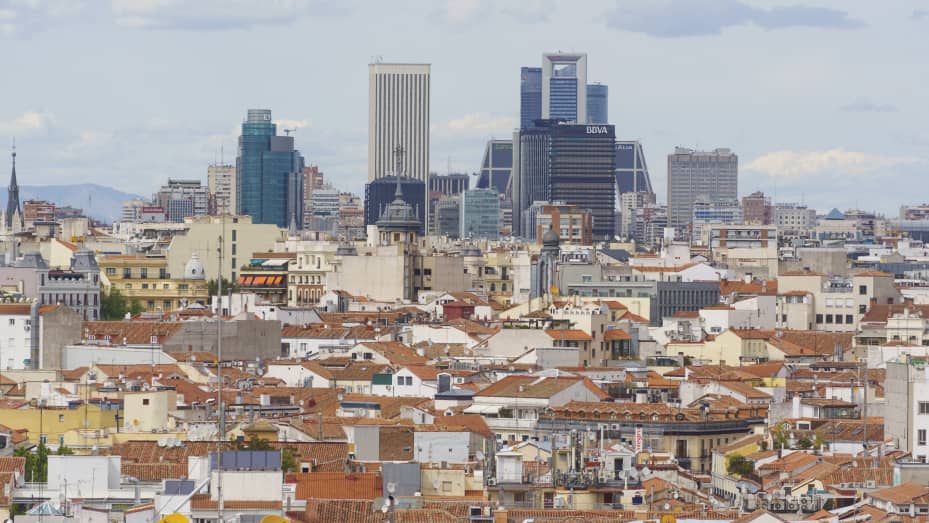 Office skyscrapers stand on the city skyline beyond rooftops in Madrid, on Monday, April 29, 2019.