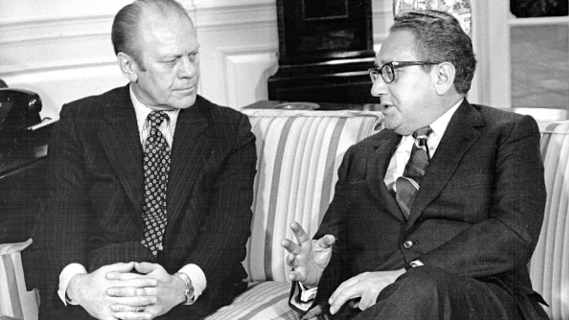 President Gerald Ford (left) and Secretary of State Henry Kissinger talk together in the Oval Office, February 19, 1975. Kissinger had just completed a 10-day trip to the Middle East.