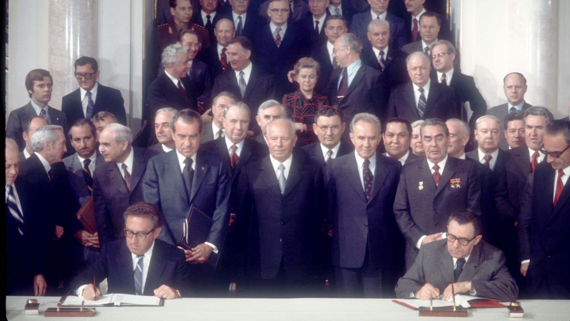 President Richard Nixon and Soviet leader Leonid Brezhnev watch as US Secretary of State Henry Kissinger and Soviet Foreign Minister Andrei Gromyko sign the SALT agreement May 26, 1972, in the Kremlin.