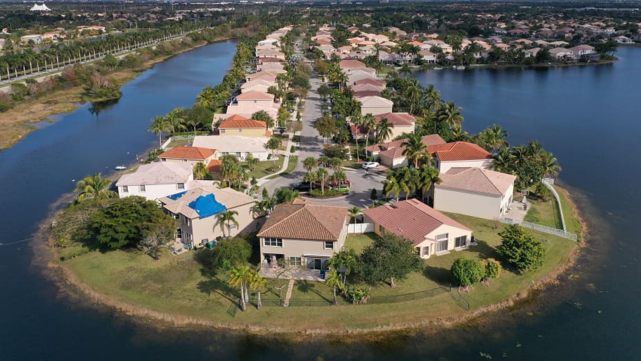 An aerial view from a drone shows homes in a neighborhood on January 26, 2021 in Miramar, Florida. According to two separate indices existing home prices rose to the highest level in 6 years.