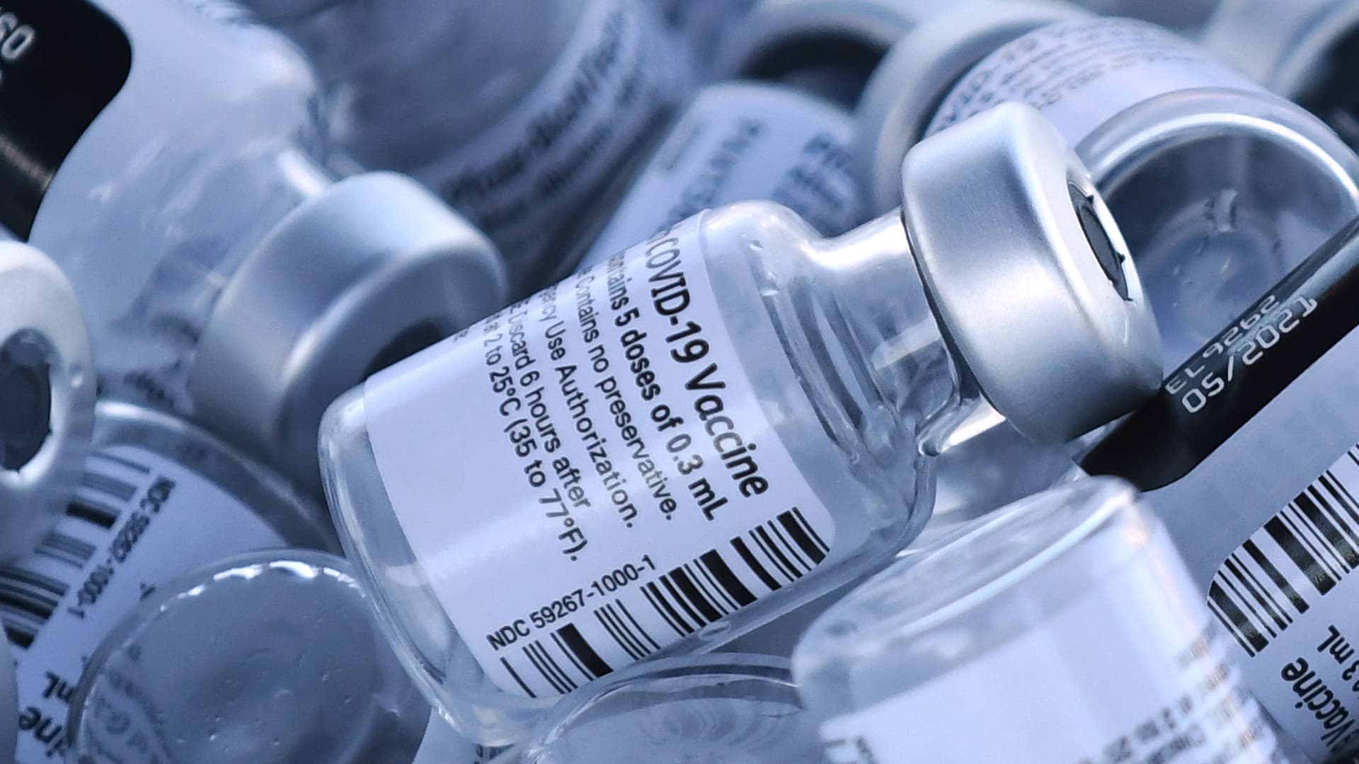 Empty vials of the Pfizer COVID-19 vaccine are seen at a first come first serve drive-thru vaccination site operated by the Lake County Health Department on January 28, 2021 in Groveland, Florida.