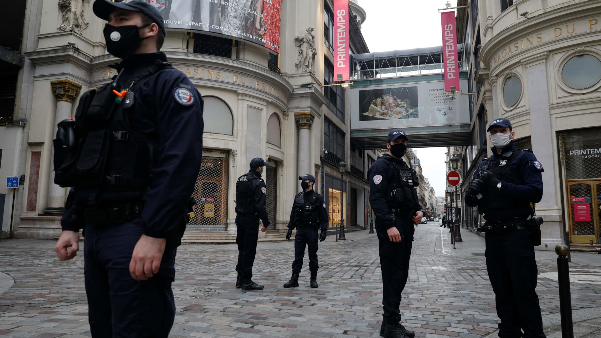 Policemen patrol near Le Printemps shopping center in Paris on January 21, 2021, as big shopping centres are closed as a measure taken to curb the spread of the Covid-19. - France closed its borders to all non-EU travellers except those on essential trips, and closed big shopping centres of 20.000m2 or more, except those selling food. (Photo by GEOFFROY VAN DER HASSELT / AFP) (Photo by GEOFFROY VAN DER HASSELT/AFP via Getty Images)