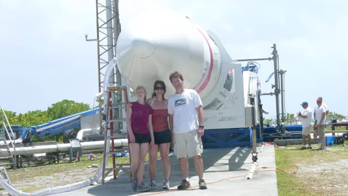Hans Koenigsmann stands with his family in front of a Falcon 1 rocket at the company's launch facility on Omelek Island in the Kwajalein Atoll.