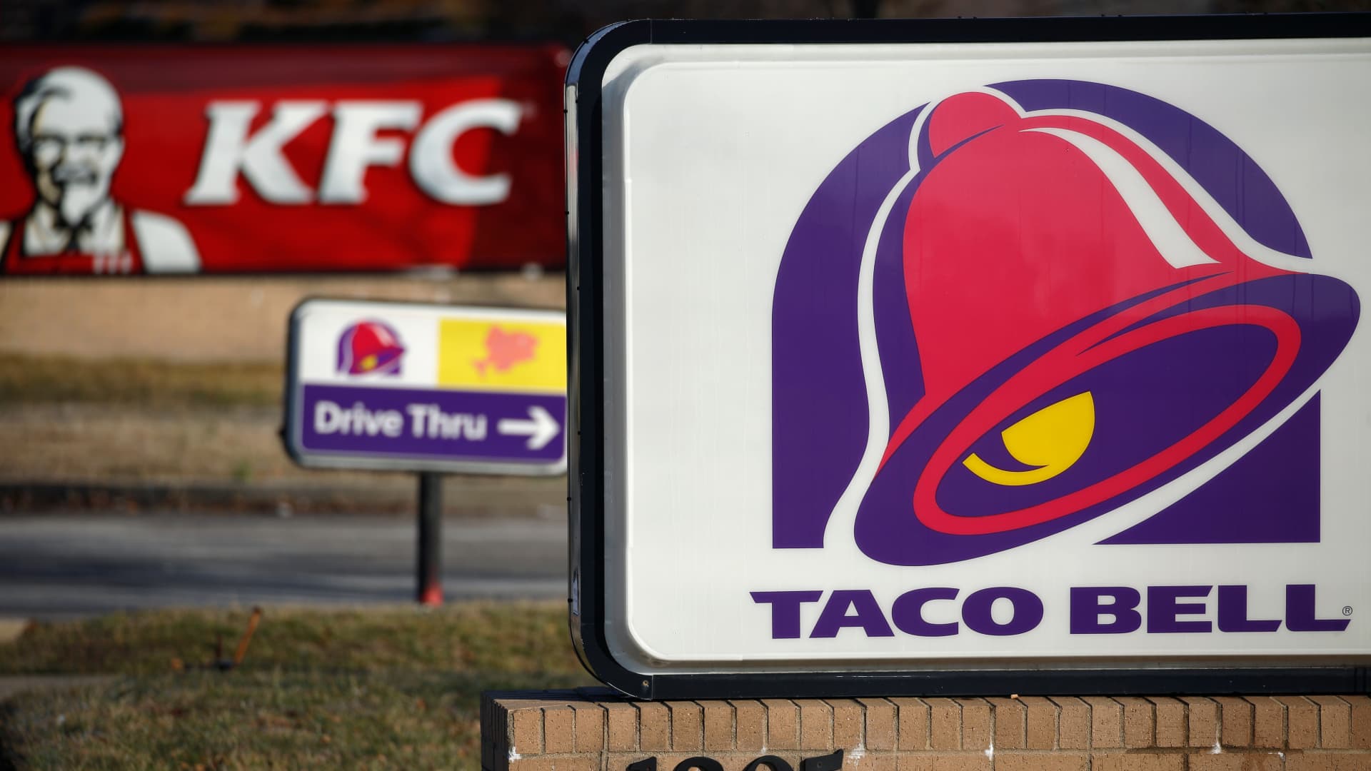 Signage is displayed outside a Yum! Brands Inc. Taco Bell and Kentucky Fried Chicken (KFC) restaurant in Louisville, Kentucky, U.S., on Thursday, Jan. 30, 2020.