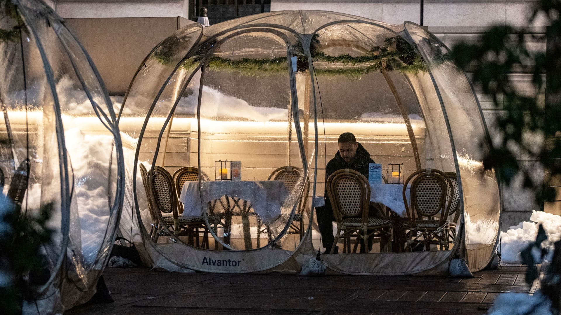 A man sits in a bubble tent as the spread of the coronavirus disease (COVID-19) continues, in New York, February 4, 2021.