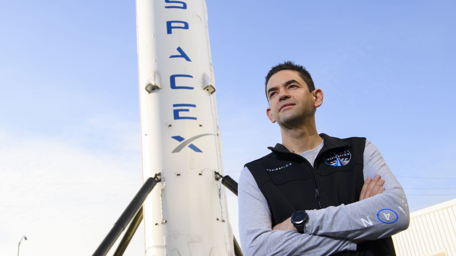 Inspiration4 mission commander Jared Isaacman, founder and chief executive officer of Shift4 Payments, stands for a portrait in front of the recovered first stage of a Falcon 9 rocket at Space Exploration Technologies Corp.