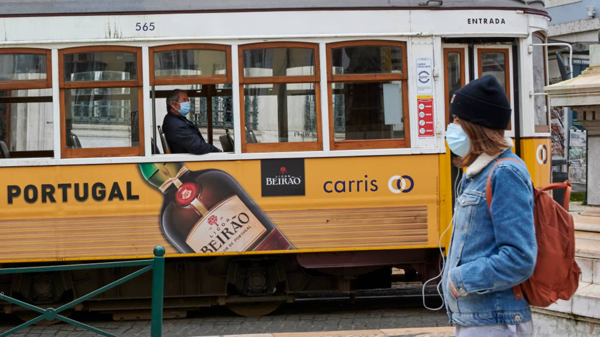 A mask-clad passenger rides alone on a Line 28 tram by Praça Luís de Camões during the COVID-19 Coronavirus pandemic on February 04, 2021 in Lisbon, Portugal. Urban transportation services are reduced due to the mandatory lockdown imposed by the government to help curve down COVID-19 contagion.