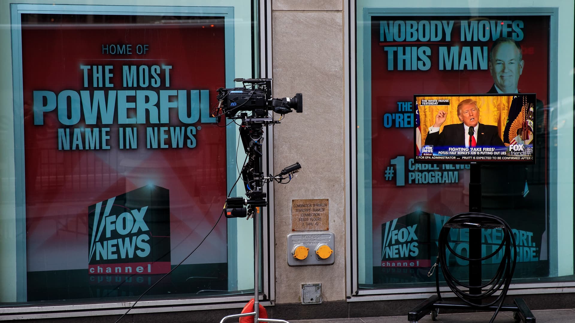 A clip of President Donald Trump's Thursday press conference is played on 'Fox And Friends', seen on a monitor outside of the Fox News studios, on February 17, 2017 in New York City.