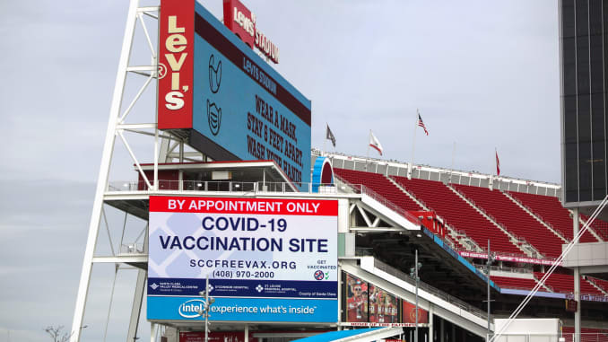 Signs show information for a vaccination site run by the Santa Clara County health department at Levi's Stadium, home of the San Francisco 49ers NFL football team, in Santa Clara, California, February 9, 2021.