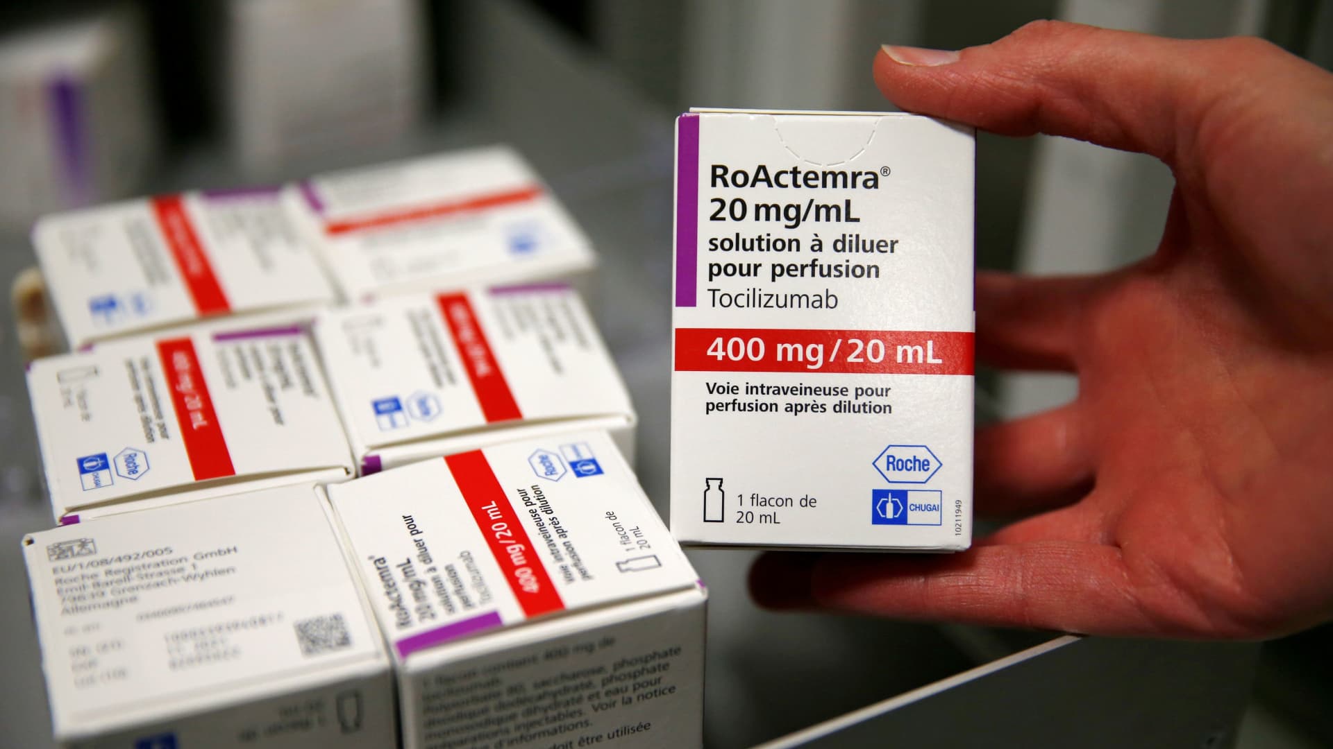 A pharmacist displays a box of tocilizumab, which is used in the treatment of rheumatoid arthritis, at the pharmacy of Cambrai hospital, France, April 28, 2020.
