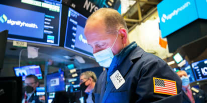 Dow falls from record amid disappointing jobs data and weak Walmart forecast