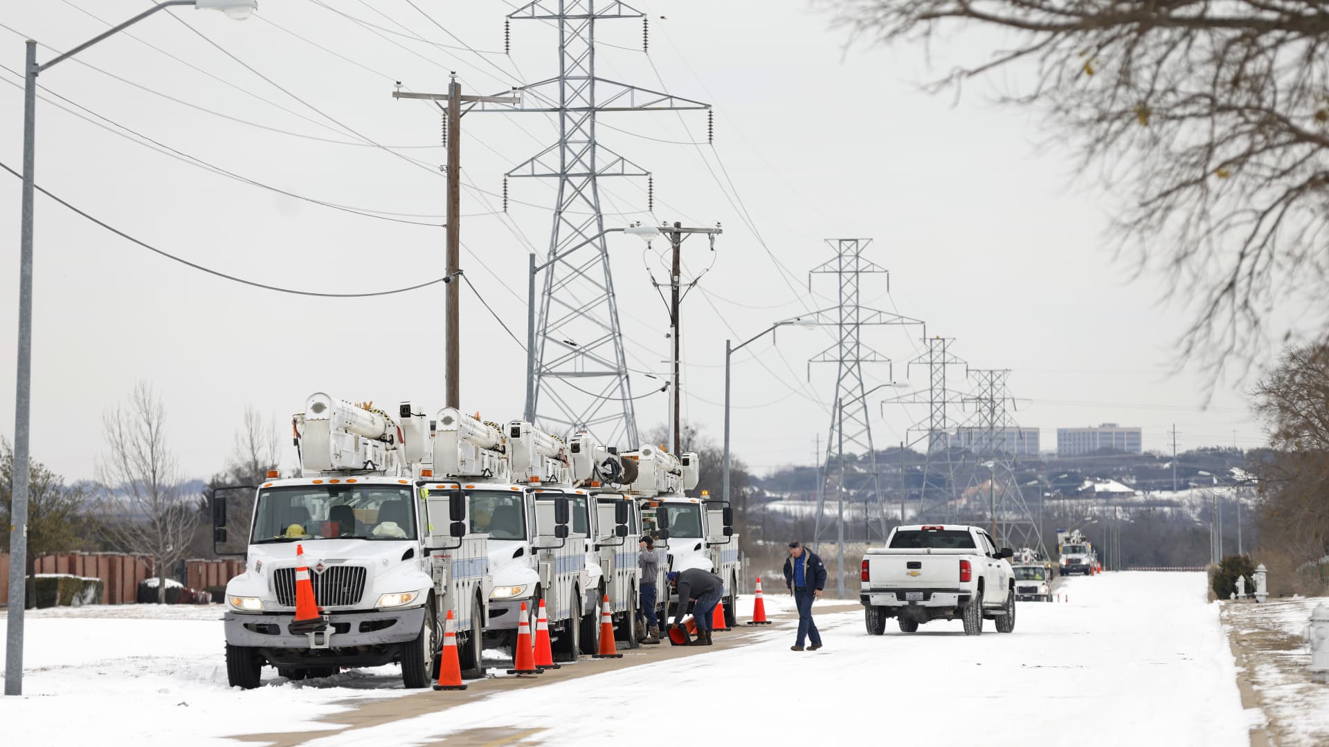 Pike Electric service trucks line up after a snow storm on February 16, 2021 in Fort Worth, Texas. Winter storm Uri has brought historic cold weather and power outages to Texas as storms have swept across 26 states with a mix of freezing temperatures and precipitation.