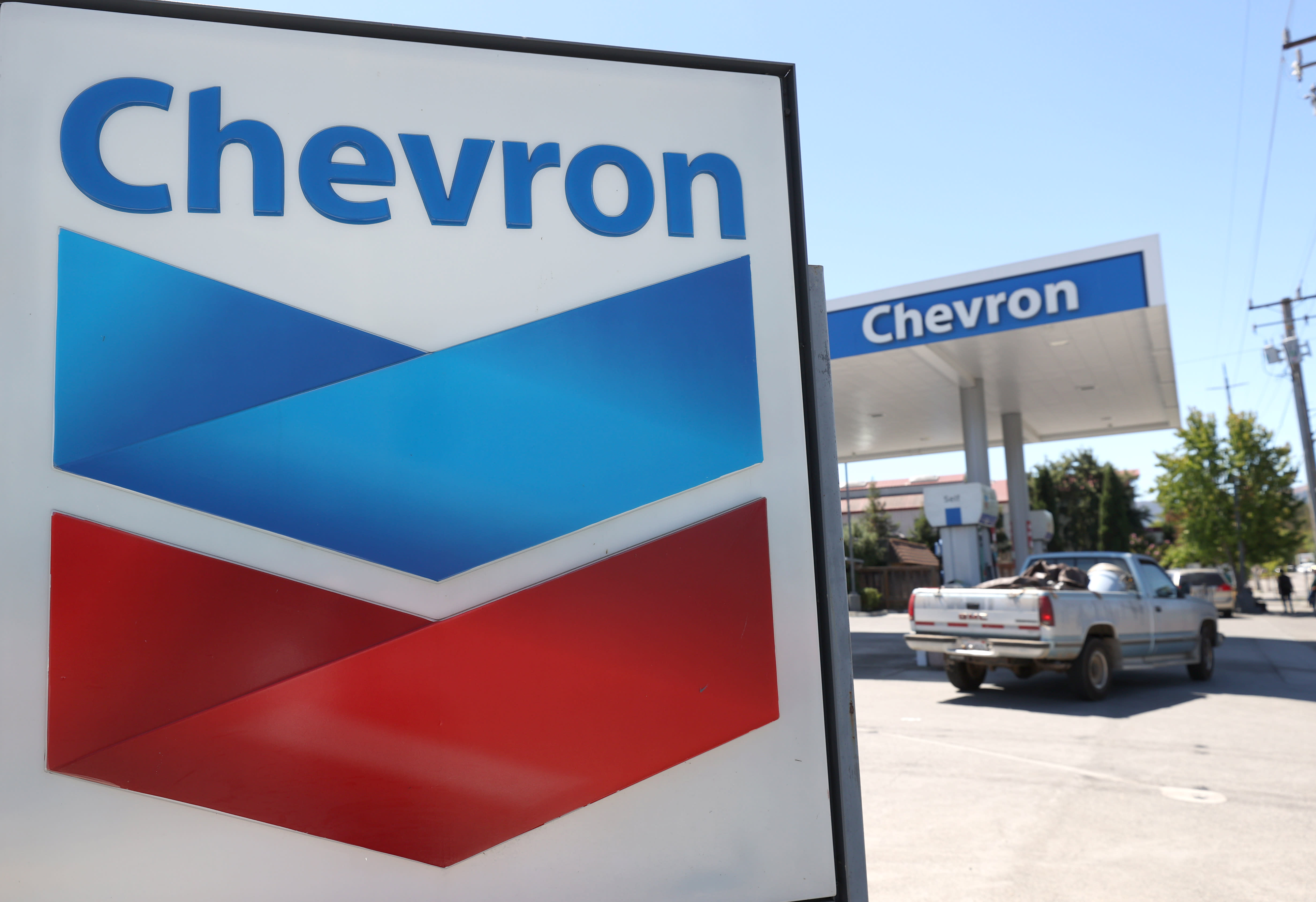 Stocks making the biggest moves midday: Chevron, Caterpillar, SunPower and more