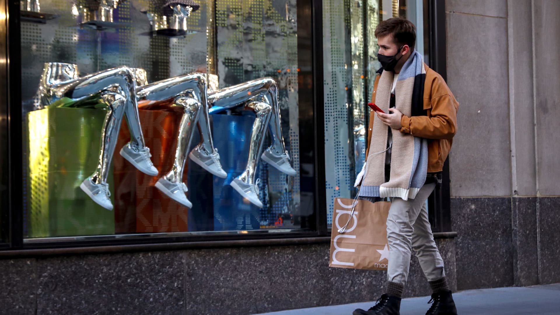 A man shops, during the coronavirus disease (COVID-19) pandemic, on 5th Avenue in New York, February 17, 2021.