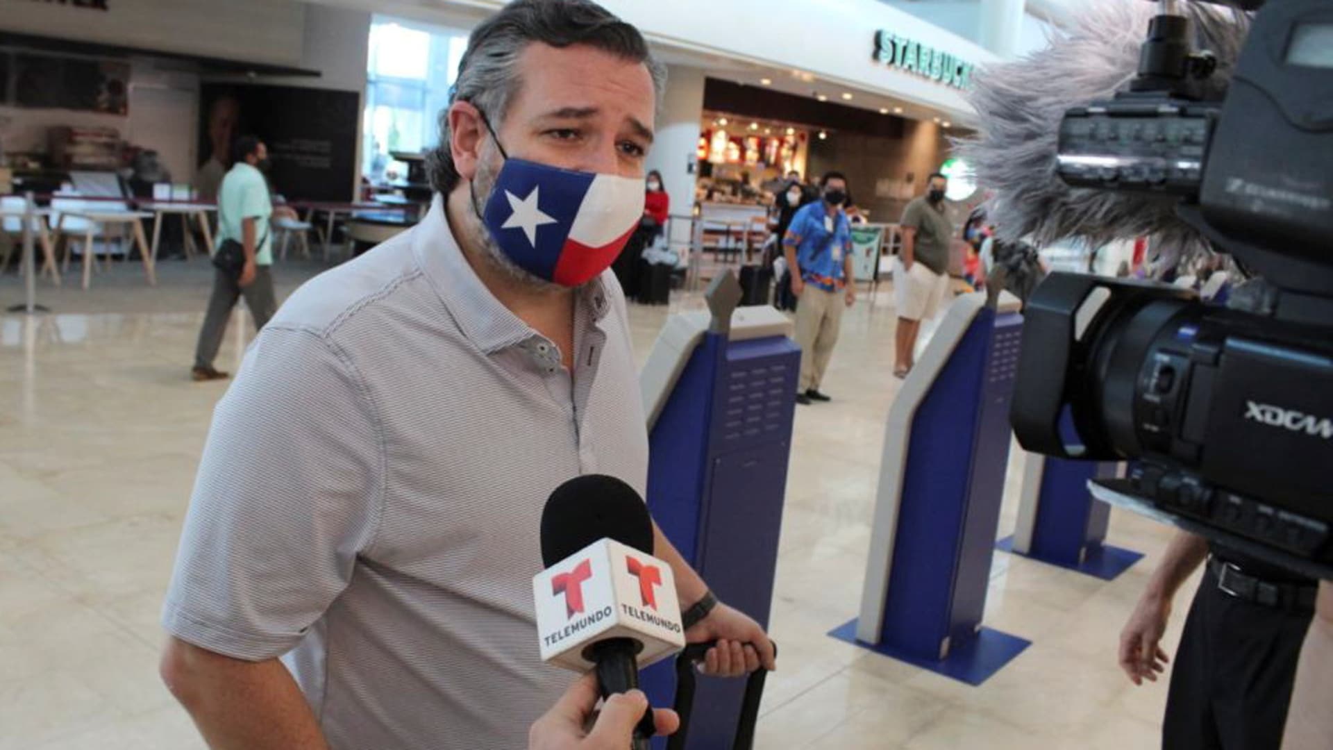 U.S. Senator Ted Cruz (R-TX) speaks to the media at the Cancun International Airport before boarding his plane back to the U.S., in Cancun, Mexico February 18, 2021.