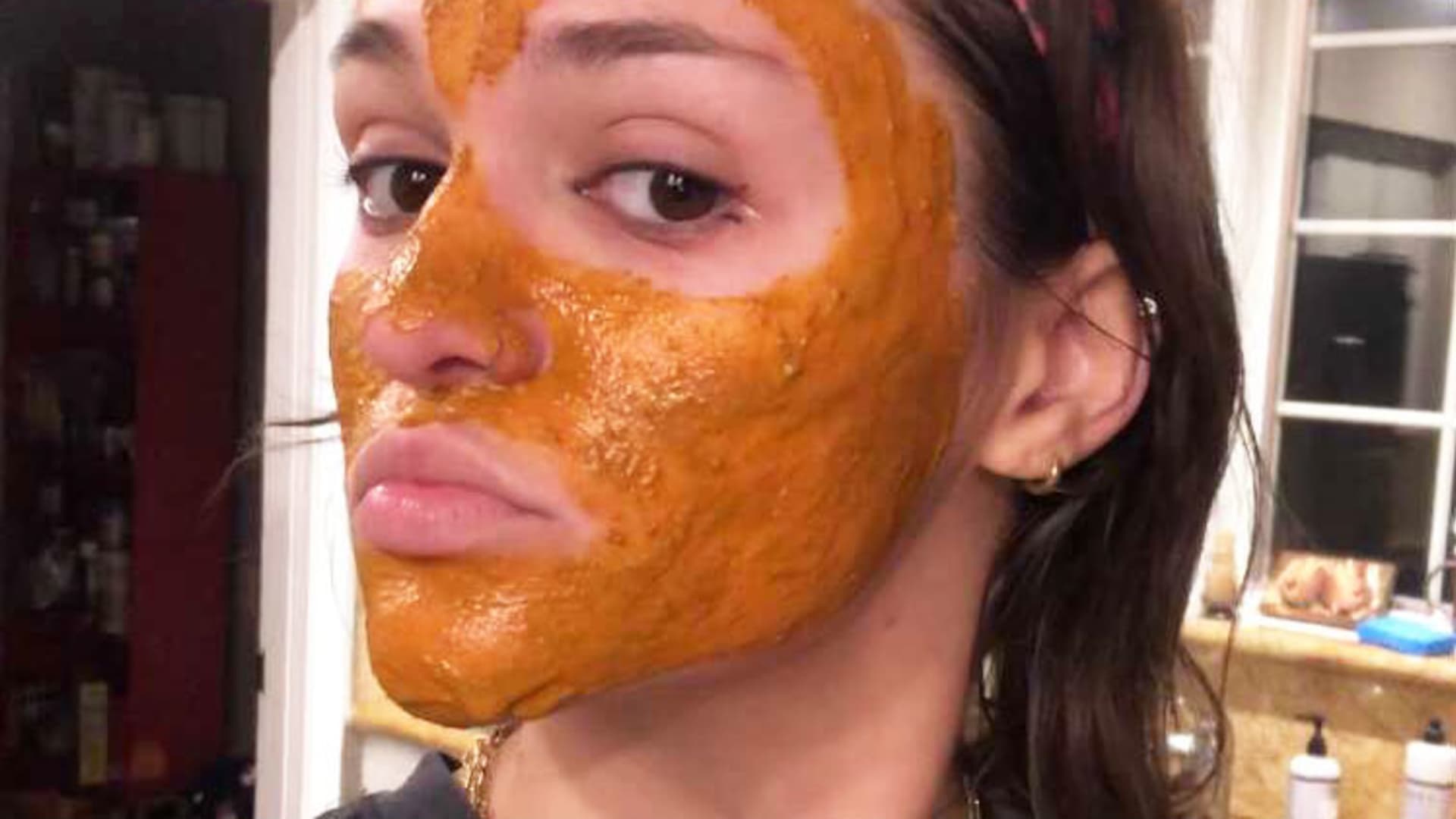 Mier applies her DIY face mask.