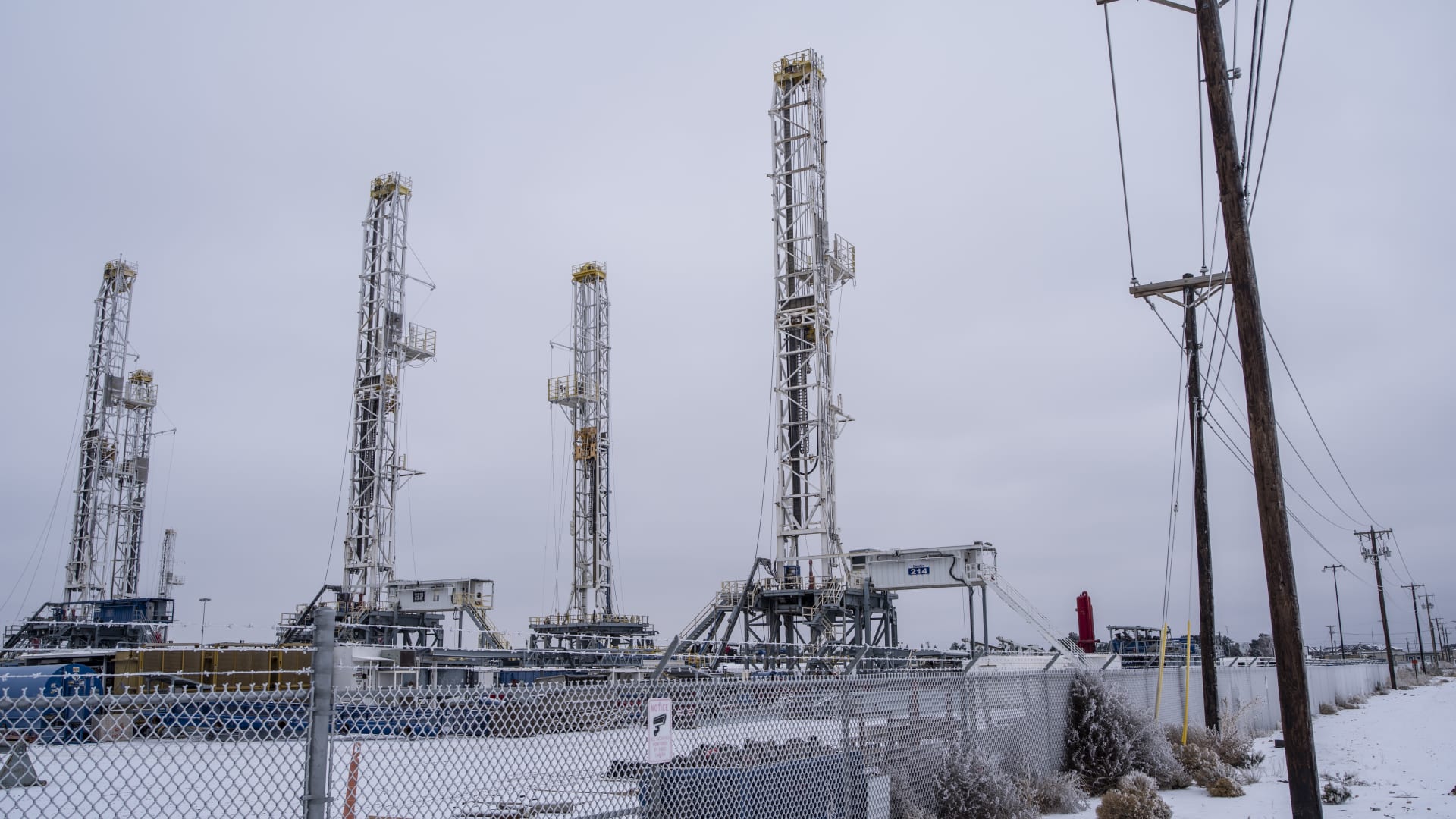 Idle oil drilling rigs in the snow at a lot near Midland, Texas, U.S, on Saturday, Feb. 13, 2021.