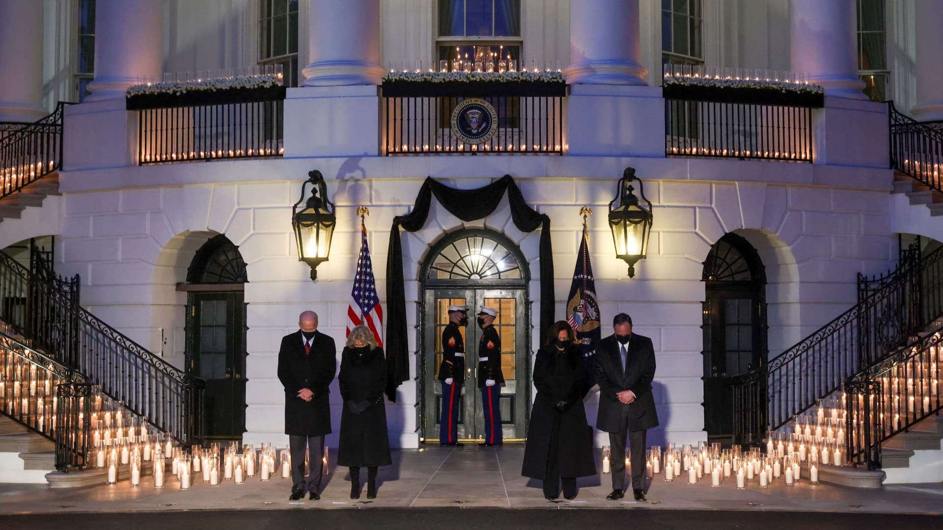 President Joe Biden, his wife Jill Biden, U.S. Vice President Kamala Harris and Second Gentleman Doug Emhoff attend a moment of silence and candle lighting ceremony to commemorate the grim milestone of 500,000 U.S. deaths from the coronavirus disease (COVID-19) at the White House in Washington, U.S., February 22, 2021.