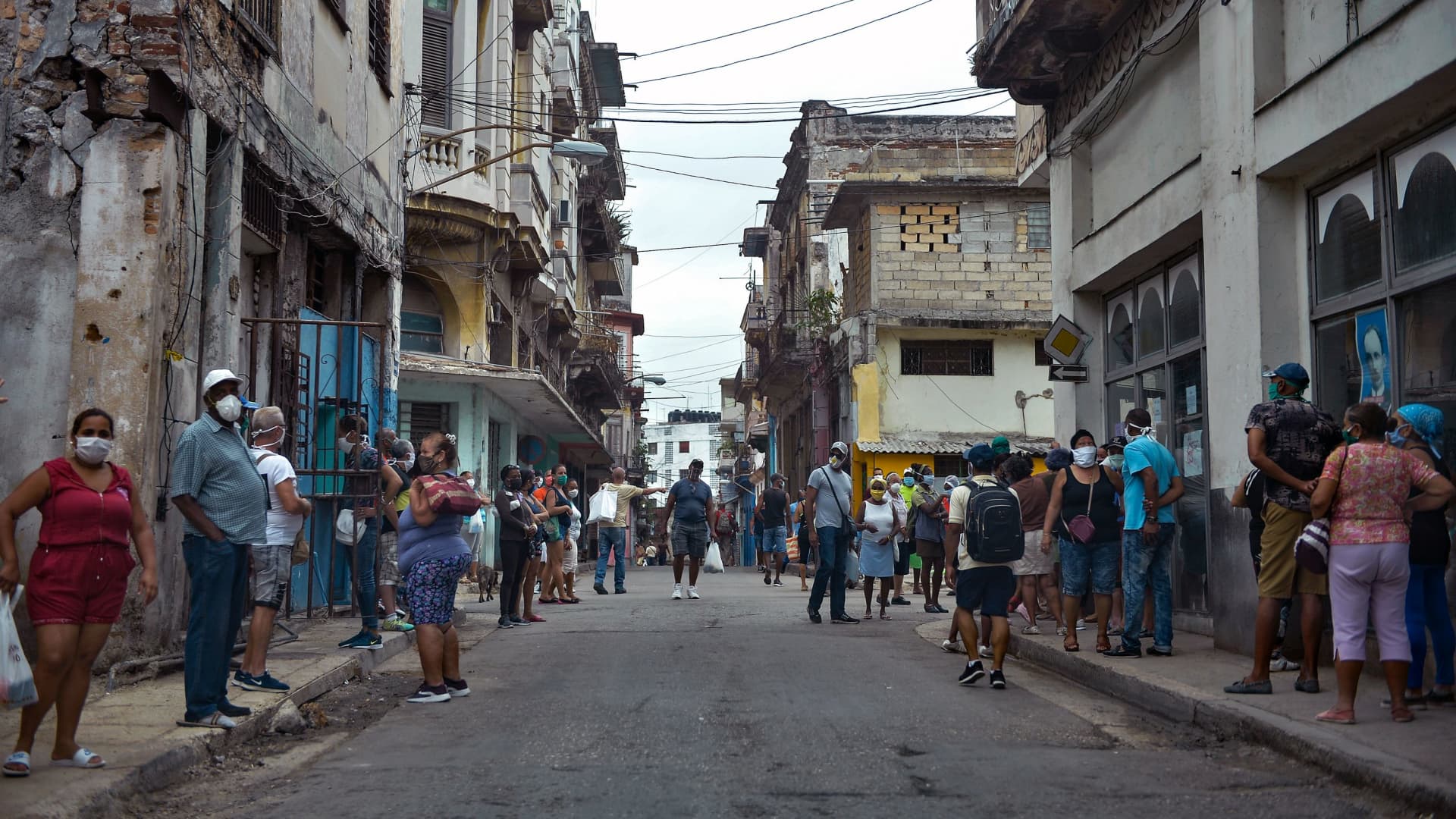 People queue to buy food in Havana, on February 2, 2021, as Covid-19 cases surge in the island nation.
