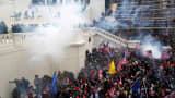 Police release tear gas into a crowd of pro-Trump protesters during clashes at a rally to contest the certification of the 2020 U.S. presidential election results by the U.S. Congress, at the U.S. Capitol Building in Washington, January 6, 2021.
