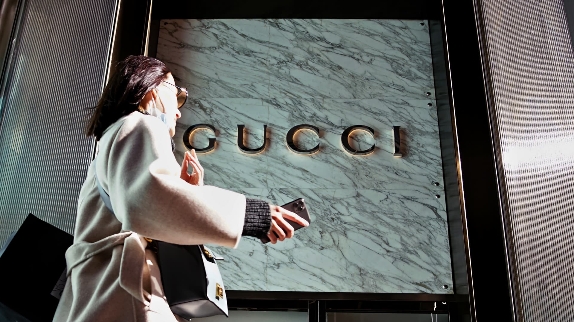 A woman walks in front of the Gucci store on Fifth Avenue in Trump Tower on February 24, 2021 in New York City.