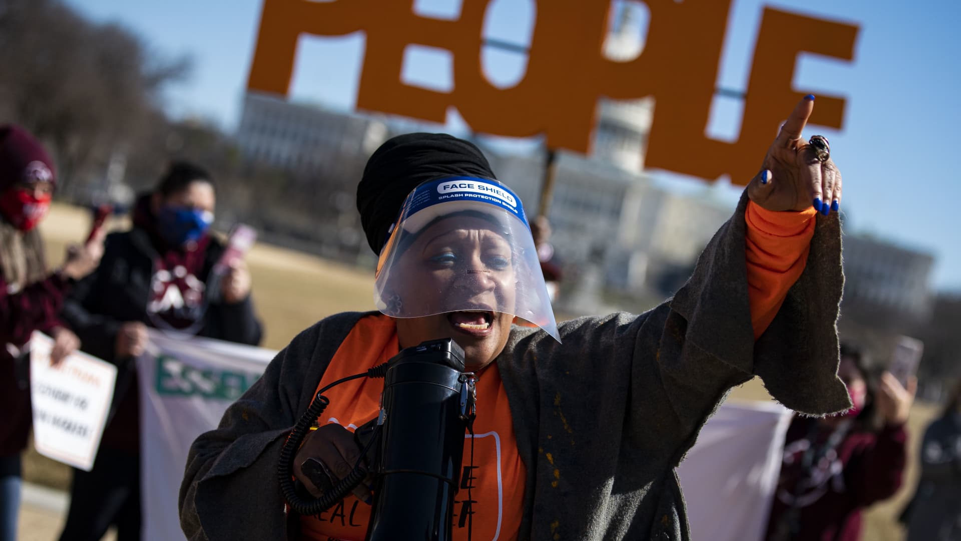People rally during a demonstration in support of Covid-19 relief, organized by Shutdown DC, on the National Mall in Washington, D.C., on Feb. 25, 2021.