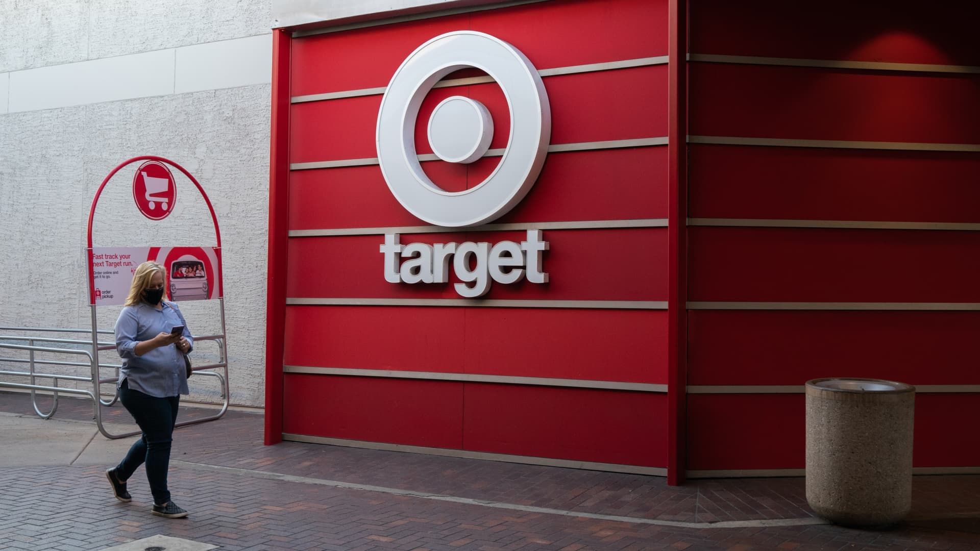 A person wearing a protective mask walks past a Target Corp. store at the Grossmont Center Mall in La Mesa, California, U.S., on Thursday, Feb. 11, 2021.