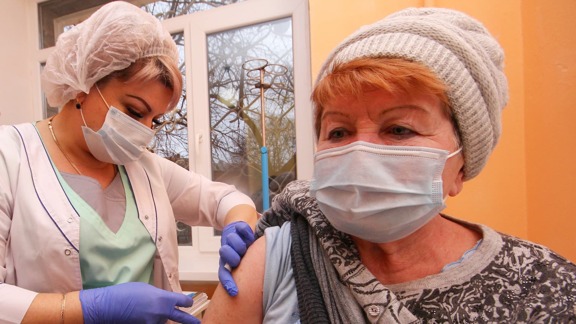 A woman receives the second component of the Gam-COVID-Vac (Sputnik V) COVID-19 vaccine.