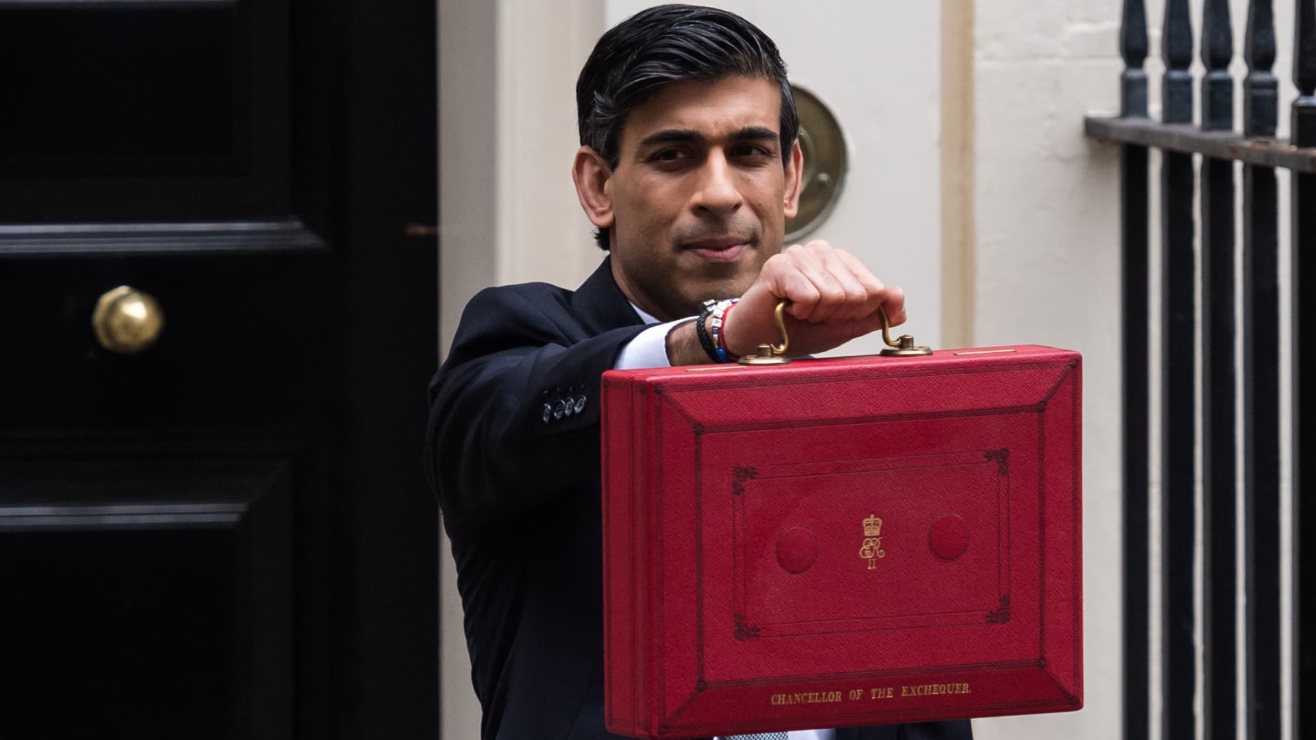 Chancellor of the Exchequer Rishi Sunak holds the Budget box outside 11 Downing Street in central London ahead of the announcement of the Spring Statement in the House of Commons on 03 March, 2021 in London, England.