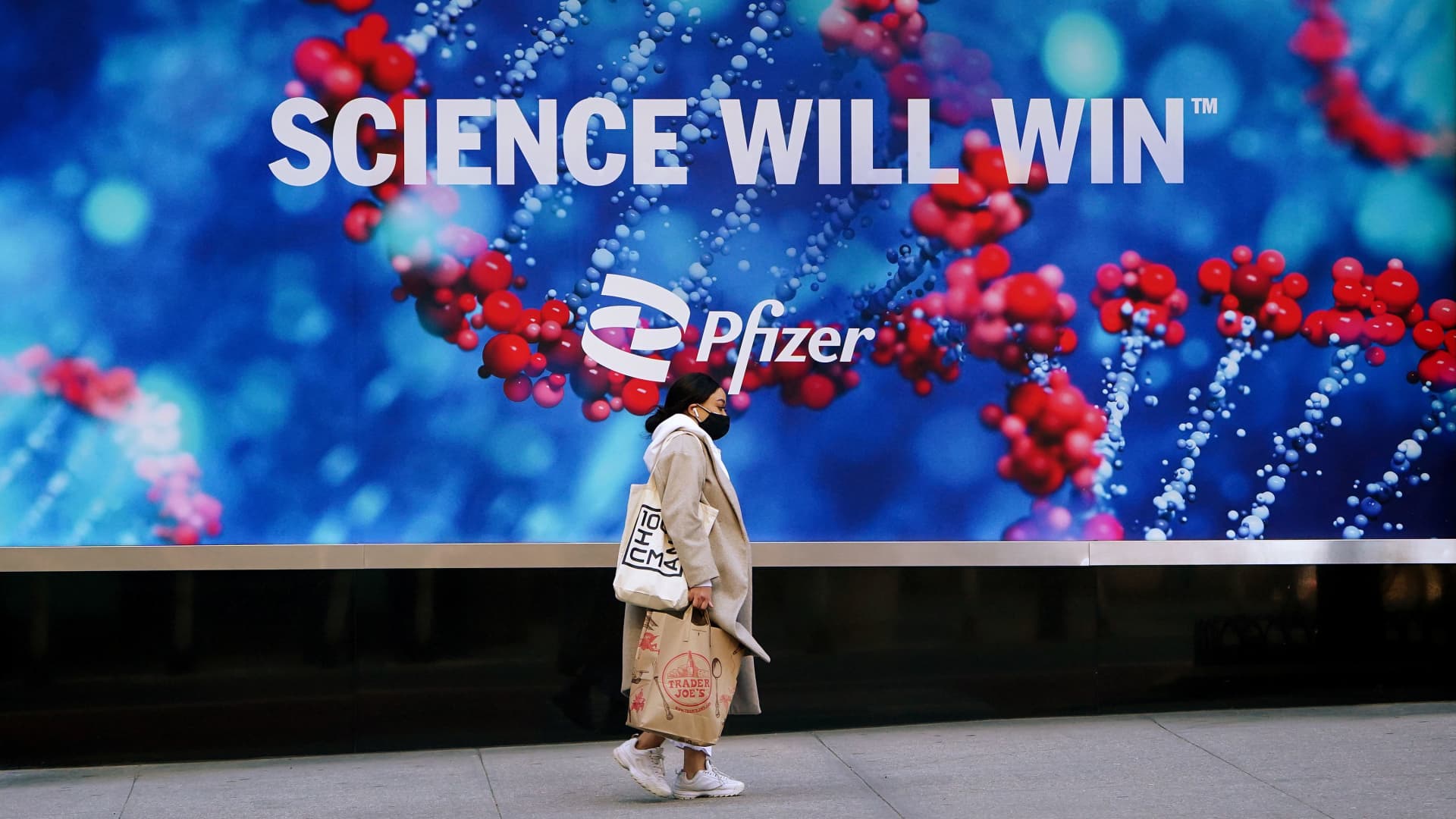 A person walks past the Pfizer building in Manhattan, New York City, U.S., March 2, 2021.