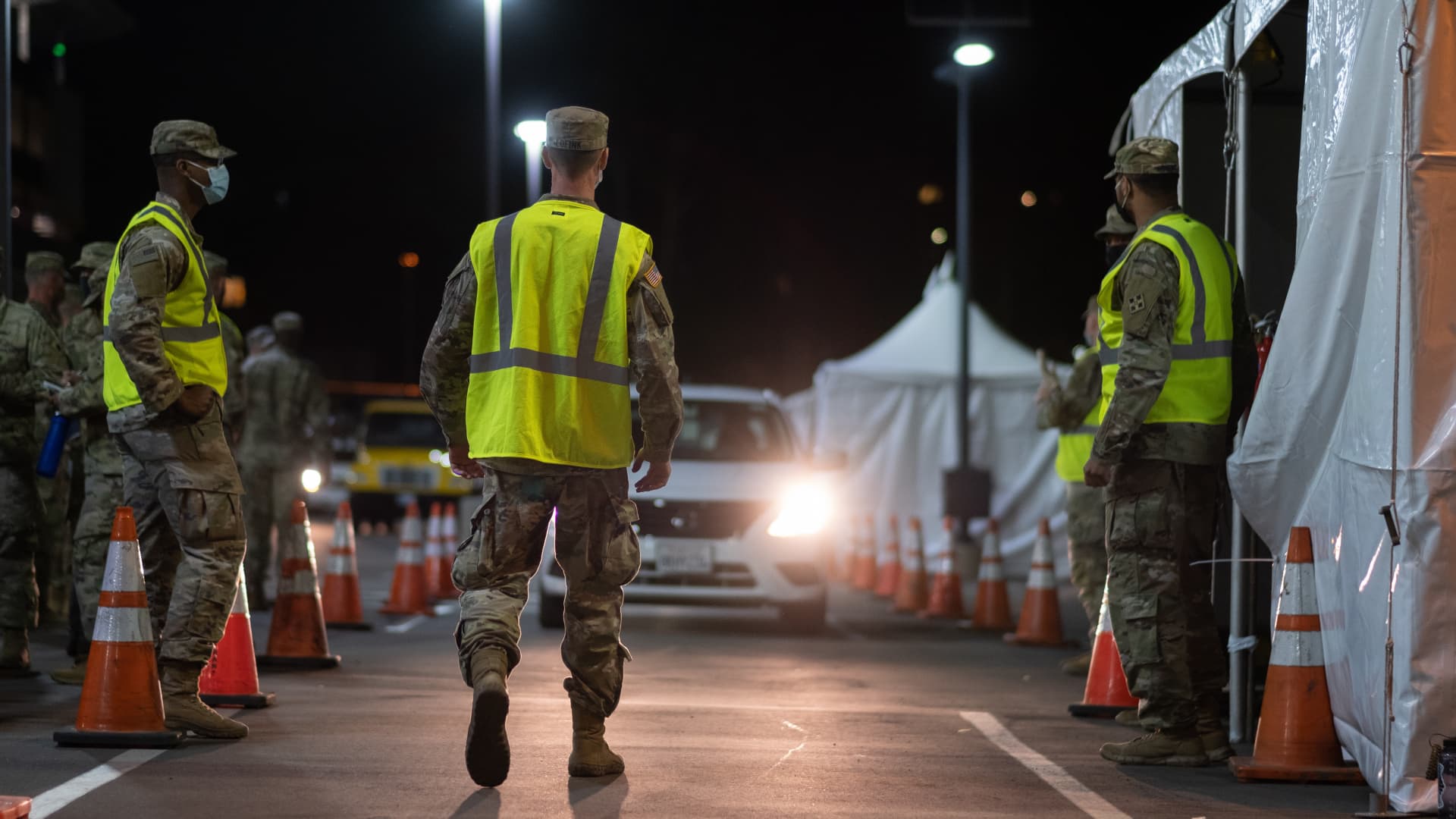 Active duty and Army National Guard soldiers prepare to receive a mock, drive-thru vaccine recipient during an exercise at California State University, Los Angeles, Feb. 14, 2021.