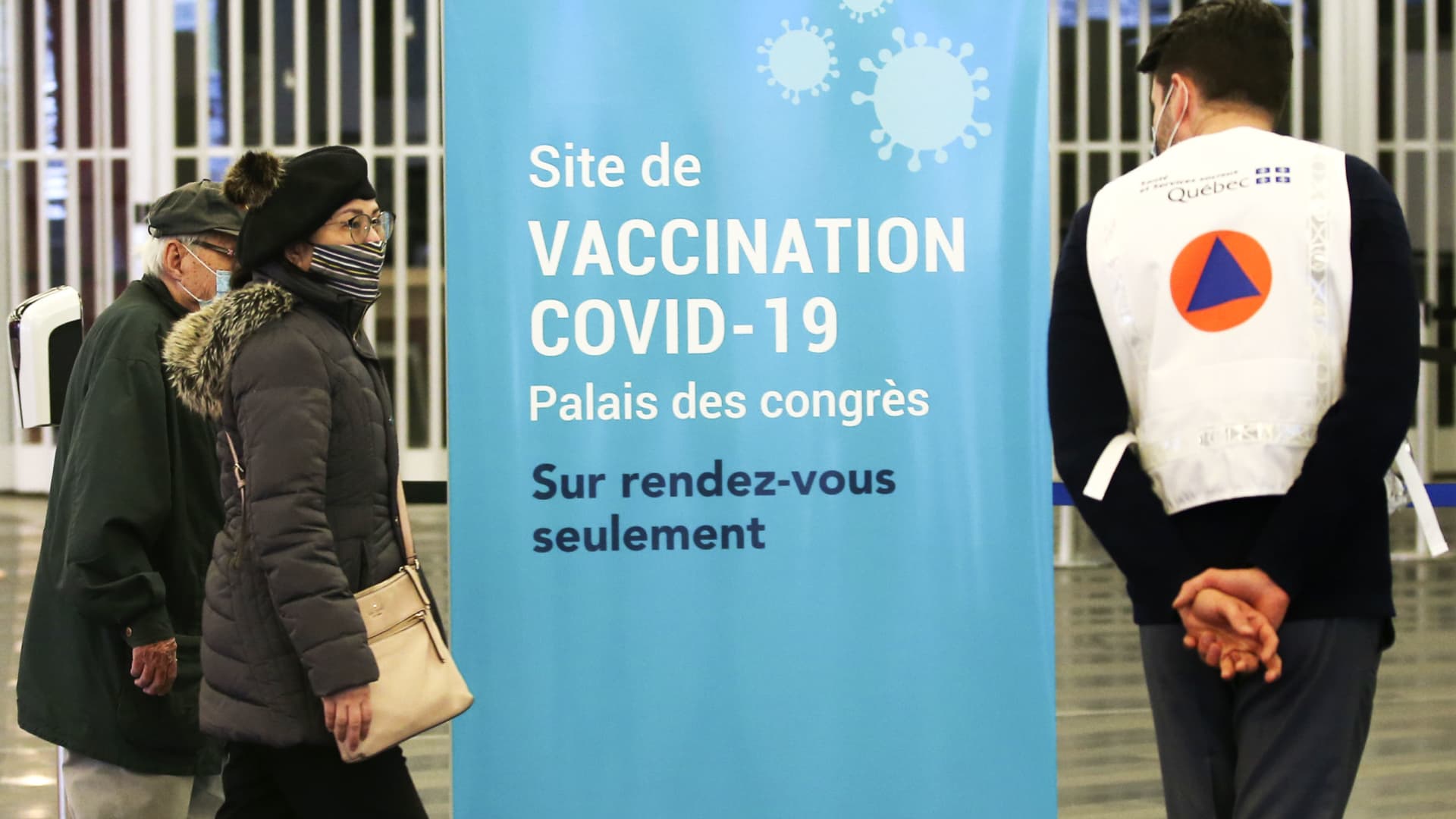 People arrive to be vaccinated at the Palais Des Congres convention centre in Montreal, Quebec, Canada, on Monday, March 1, 2021.