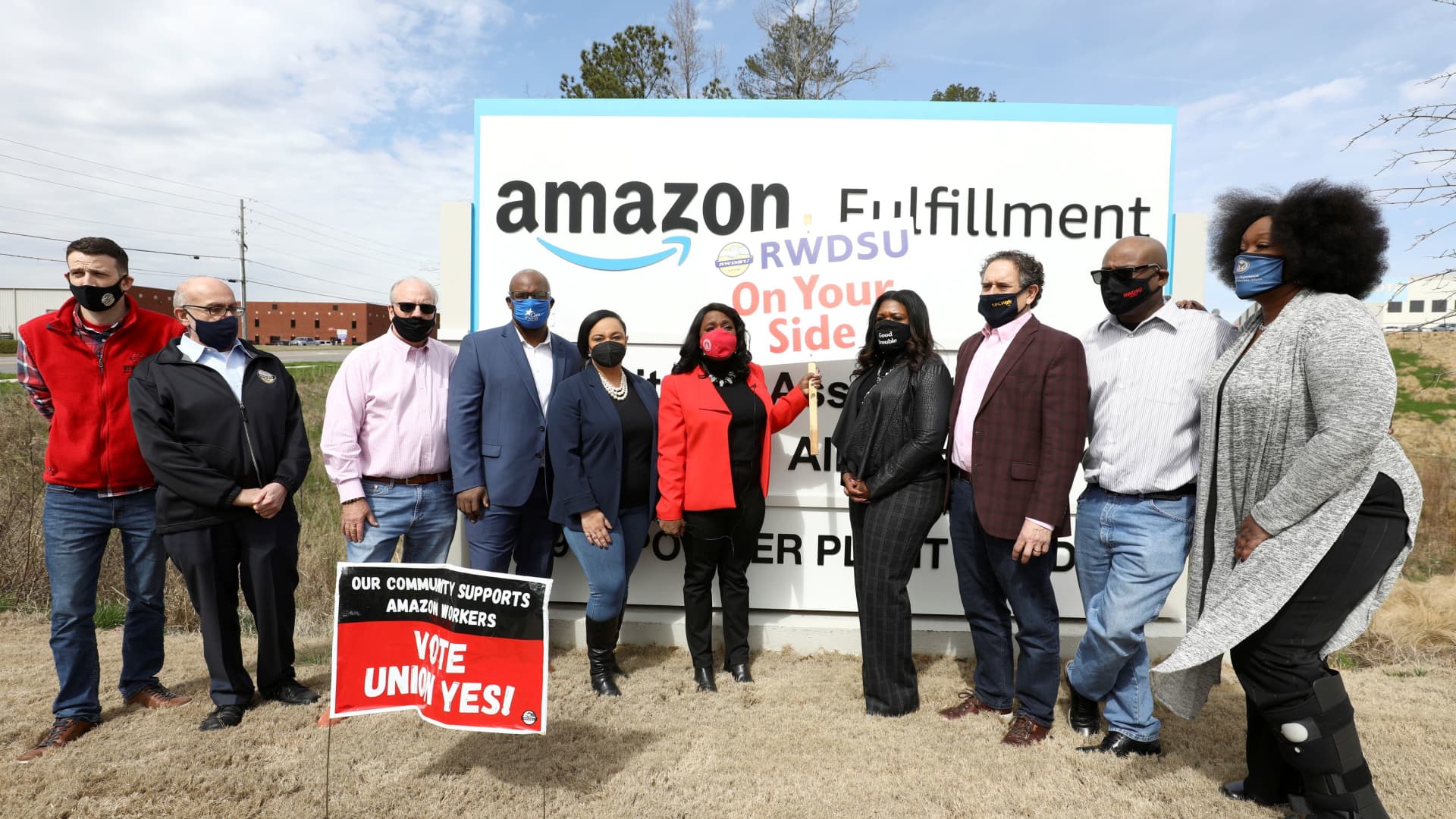 Rep. Nikema Williams, Rep. Jamaal Bowman, Rep. Terri Sewell, Rep. Cori Bush, Rep. Andy Levin and RWDSU President Stuart Appelbaum pose for a picture at the entrance to Amazon facility as they arrive as members of a congressional delegation to show their support for workers who will vote on whether to unionize, in Birmingham, Alabama, U.S. March 5, 2021.