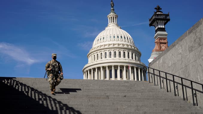 A member of the National Guard walks as the House of Representatives takes up debate of U.S. President Joe Biden's $1.9 trillion COVID-19 relief plan on Capitol Hill in Washington, March 8, 2021.