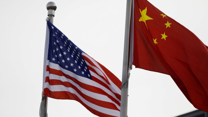 Chinese and U.S. flags outside the building of an American company in Beijing, China January 21, 2021.