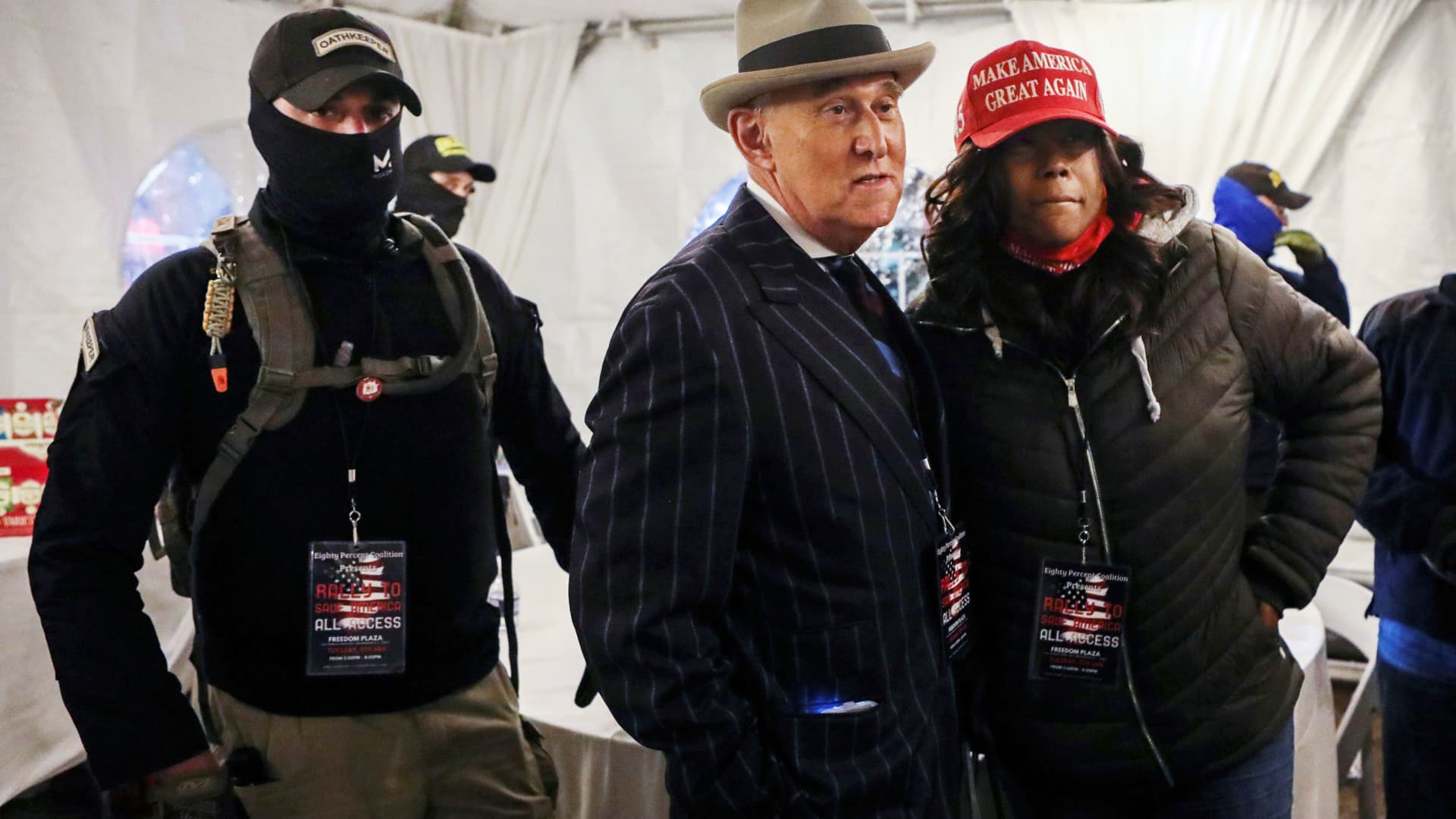 Members of the Oath Keepers provide security to Roger Stone at a rally the night before groups attacked the U.S. Capitol, in Washington, January 5, 2021.