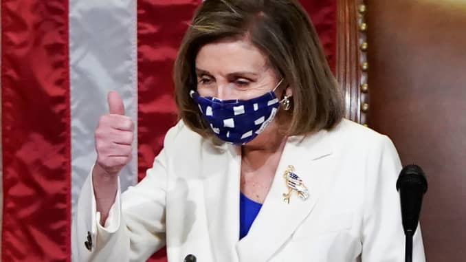 U.S. Speaker of the House Nancy Pelosi (D-CA) gives a thumbs up ahead of the final passage in the House of Representatives of U.S. President Joe Biden's $1.9 trillion coronavirus disease (COVID-19) relief bill inside the House Chamber of the Capitol in Wa