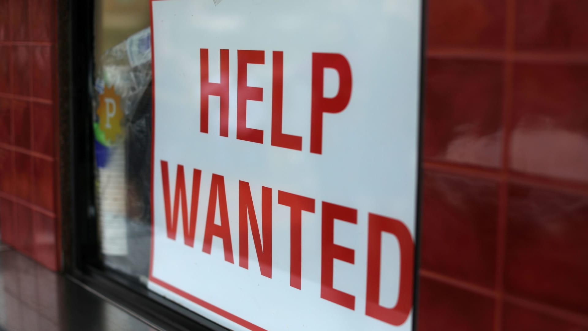 A help wanted sign is posted at a taco stand in Solana Beach, California.