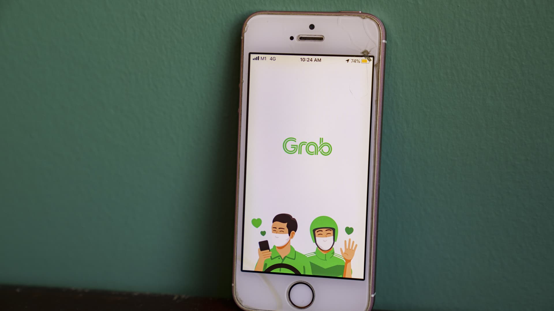 The Grab Holdings Inc. app is displayed on a smartphone in an arranged photograph taken in Singapore, on Friday, Sept. 25, 2020.